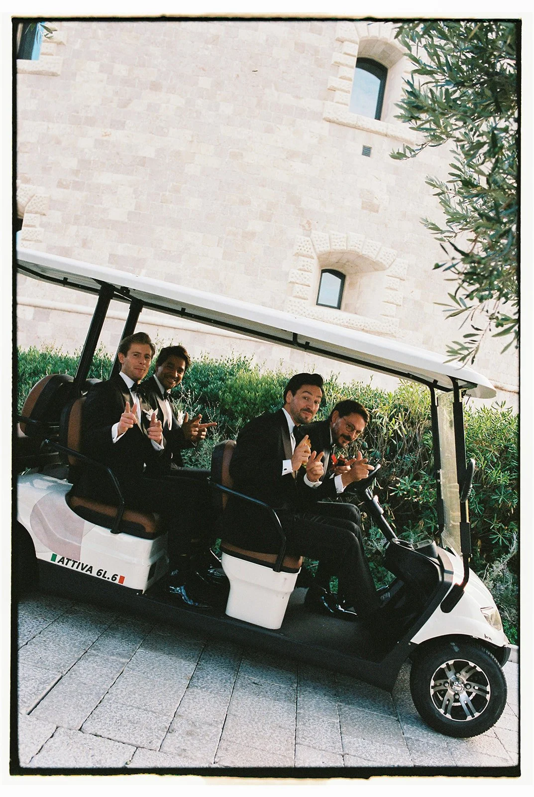 Remo getting ready with groomsmen in historic suite with original fortress frescoes and stone walls