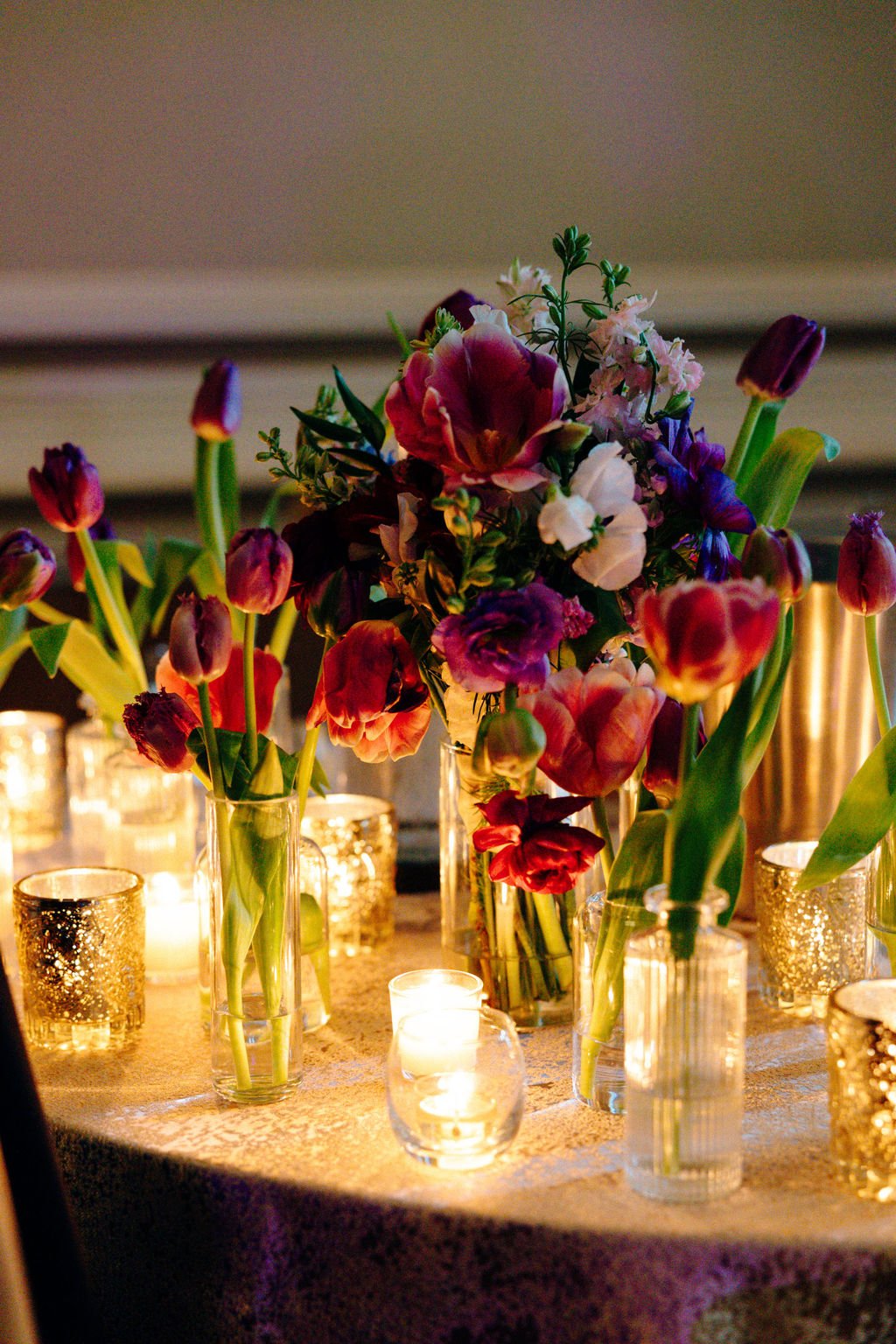 Tulips and candles at the reception, florals by Hydrangea Bloom, photographed by Christina Ney Photography