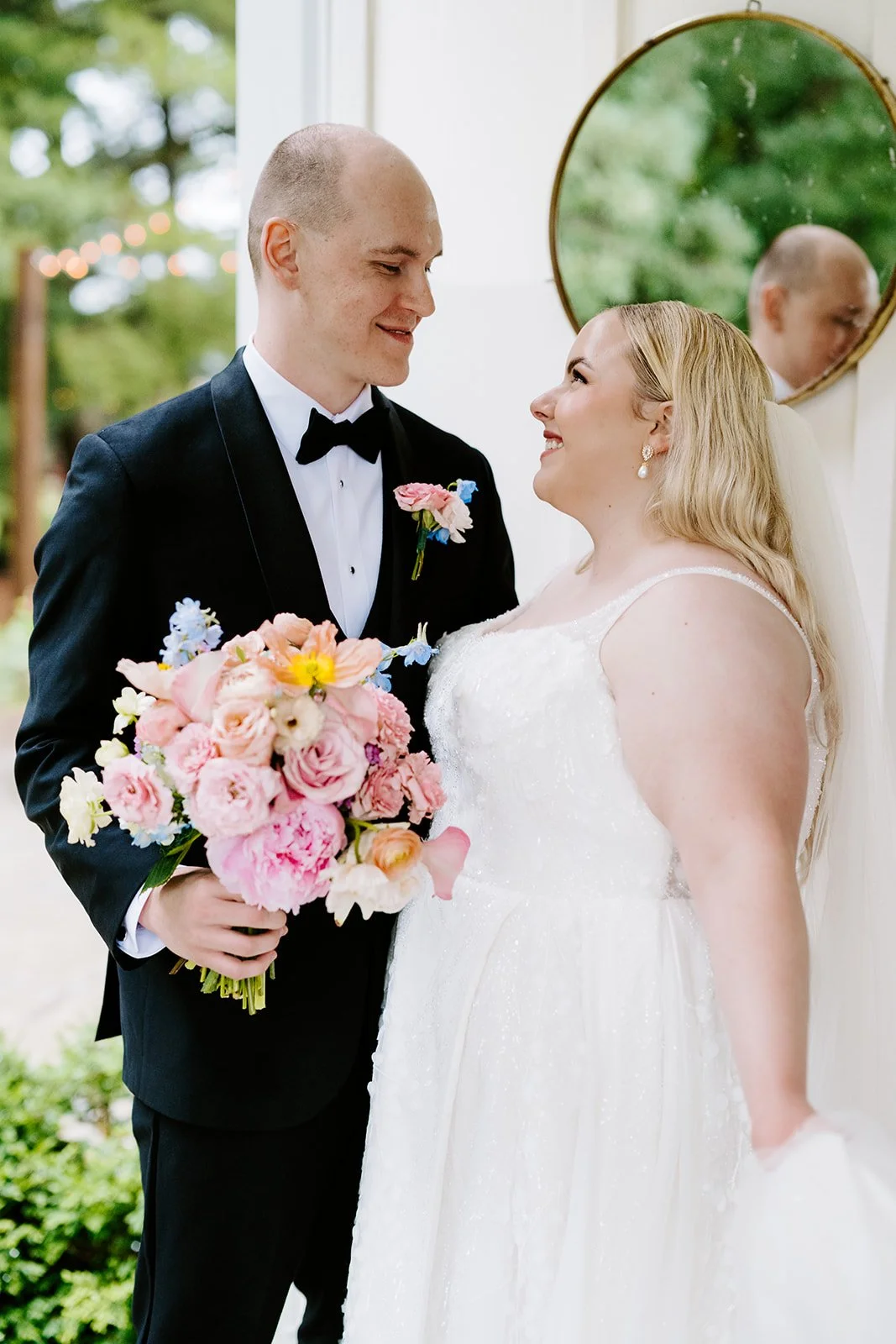 Couple with the bridal bouquet, florals by Hydrangea Bloom, photographed by Karly Ellis Photography