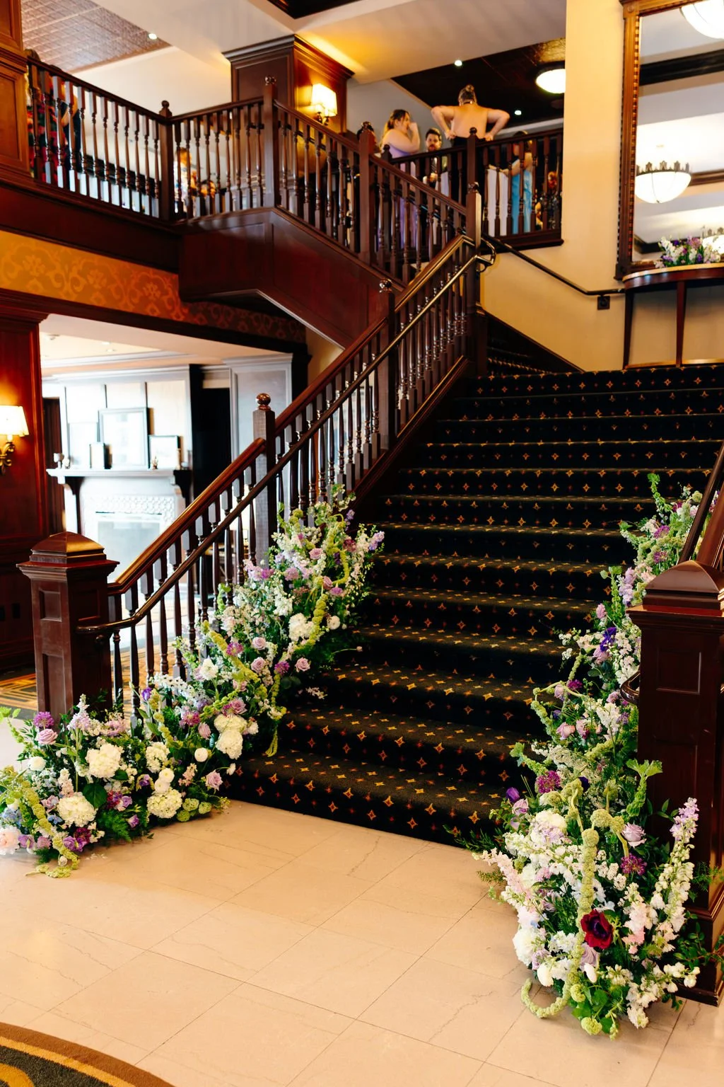 Wide view of the staircase garland, florals by Hydrangea Bloom, photographed by Christina Ney Photography