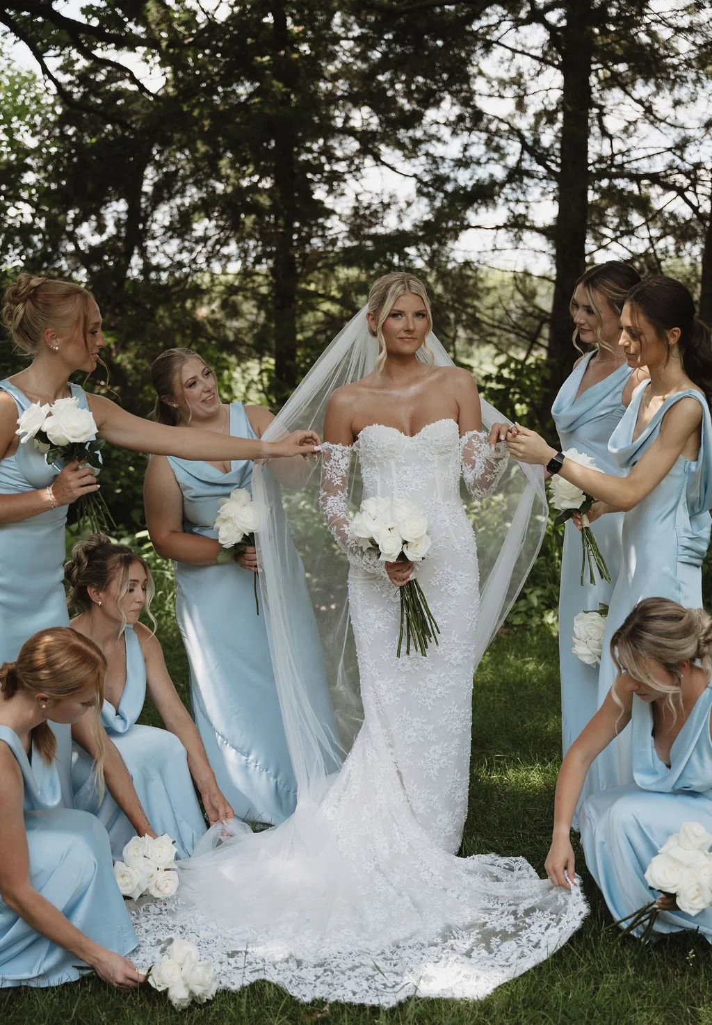 Bride and bridesmaids with white bouquets beneath the trees, florals by Hydrangea Bloom, photographed by Shelby Sawyer Photography