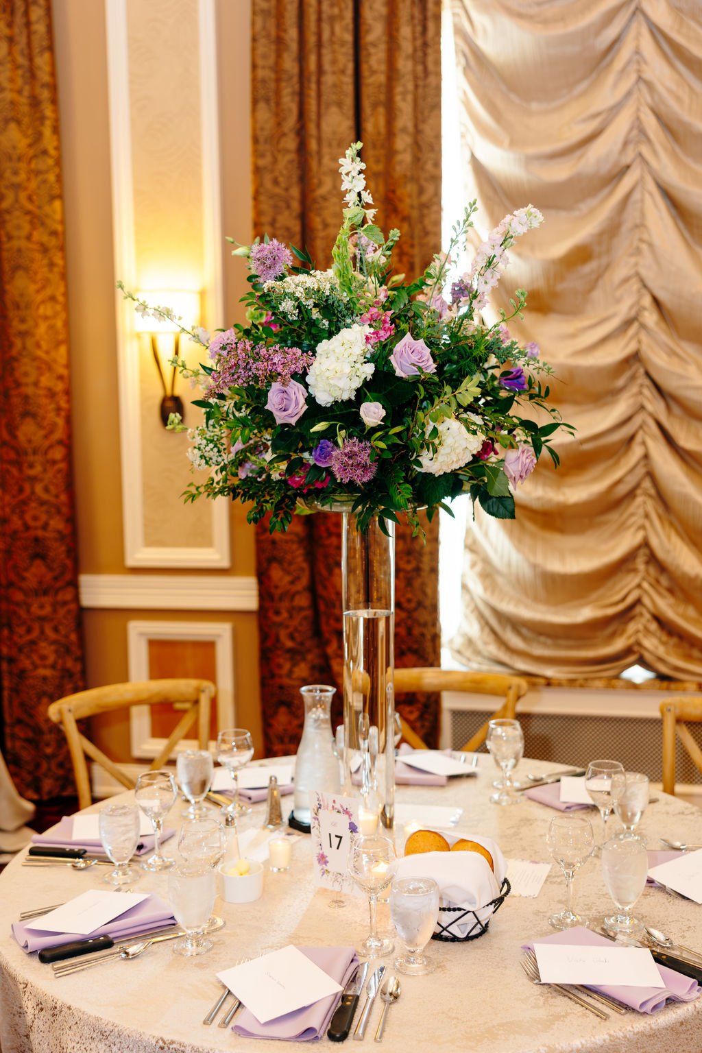 Tall reception centerpiece in lavender and white, florals by Hydrangea Bloom, photographed by Christina Ney Photography