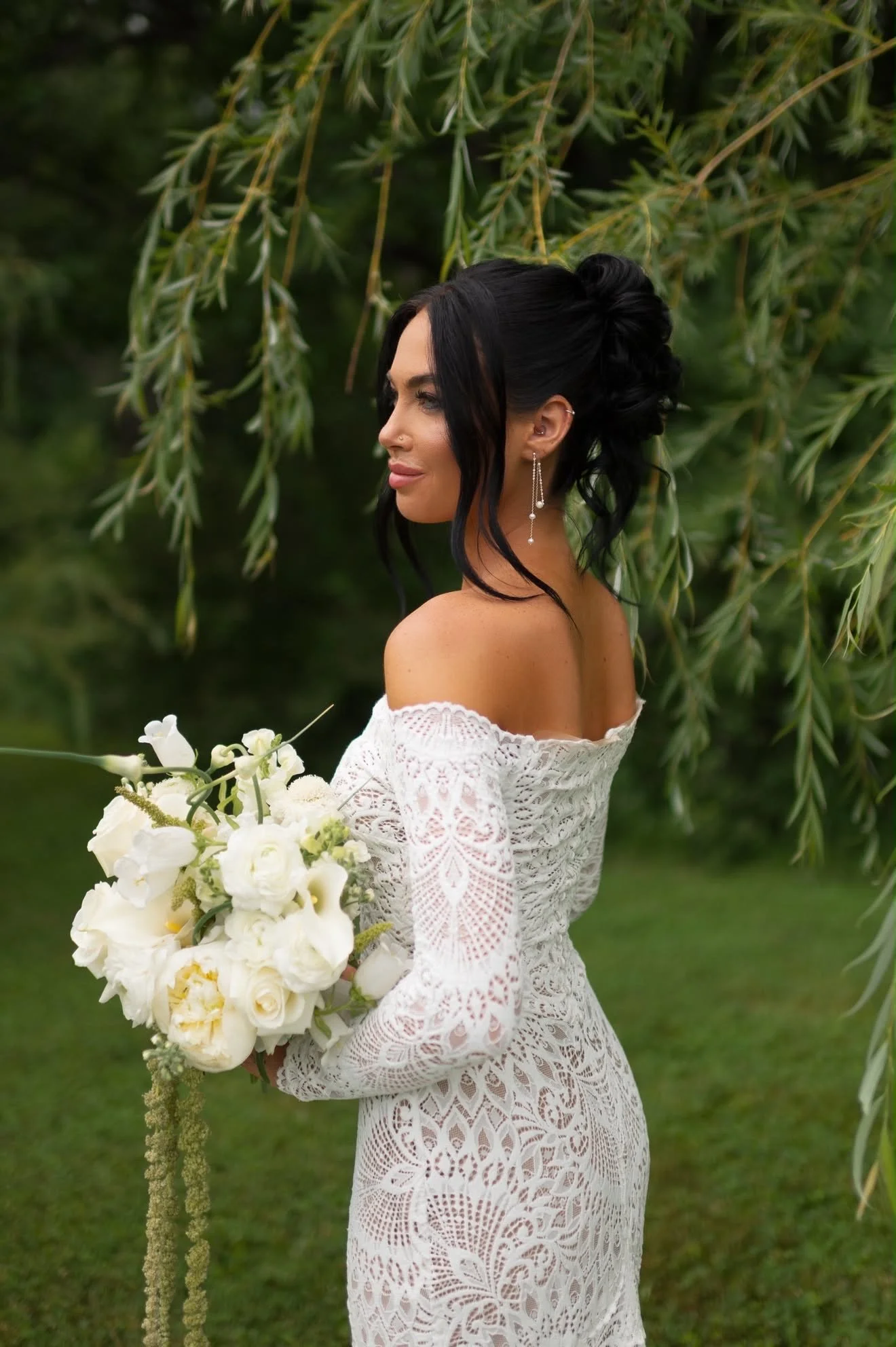 Bride holding her bouquet beneath a willow tree, florals by Hydrangea Bloom, photographed by Hayley Dolson Photography