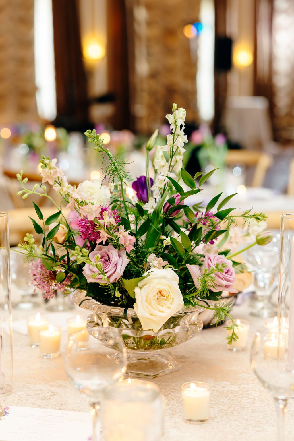 Purple and white mixed centerpiece, florals by Hydrangea Bloom, photographed by Christina Ney Photography