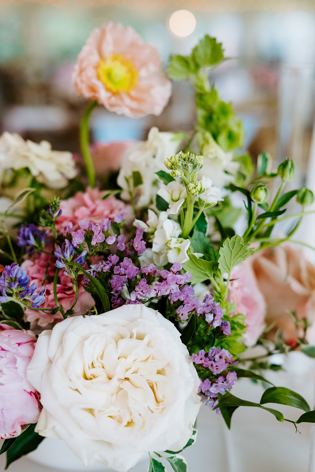 Garden-style reception centerpiece in blush, peach and violet, florals by Hydrangea Bloom, photographed by Karly Ellis Photography