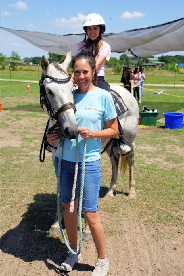 Children and volunteers participating in a camp activity at Divine Path Ranch