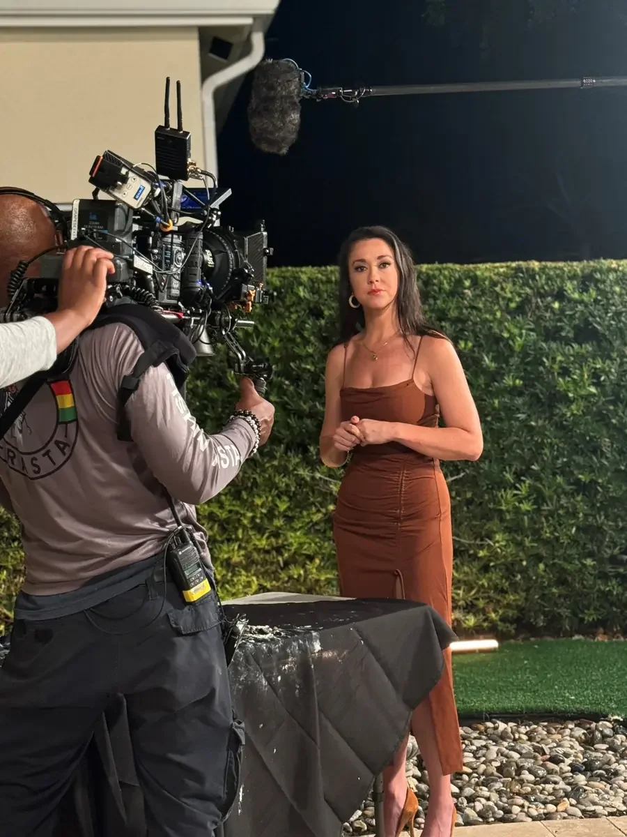 Camera crew filming a cast member