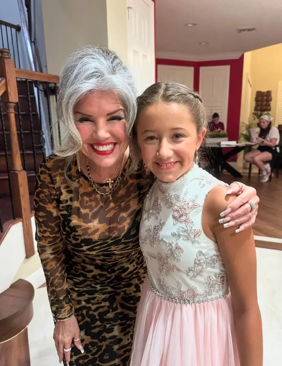 Two cast members together between scenes