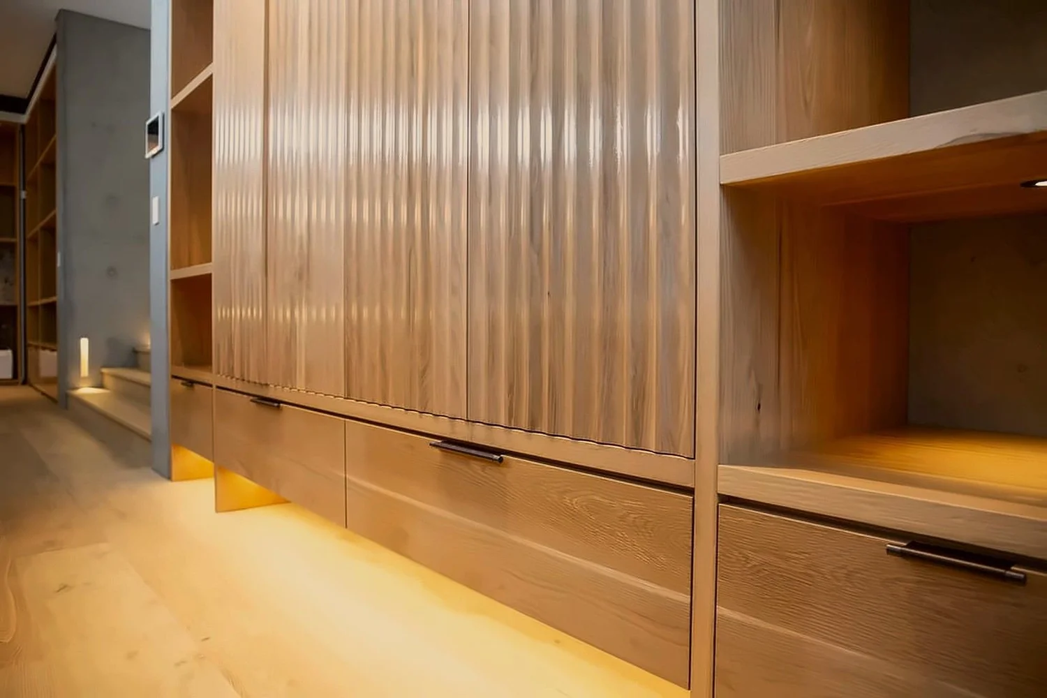 Fluted oak joinery with soft under-lighting in a private Sydney home