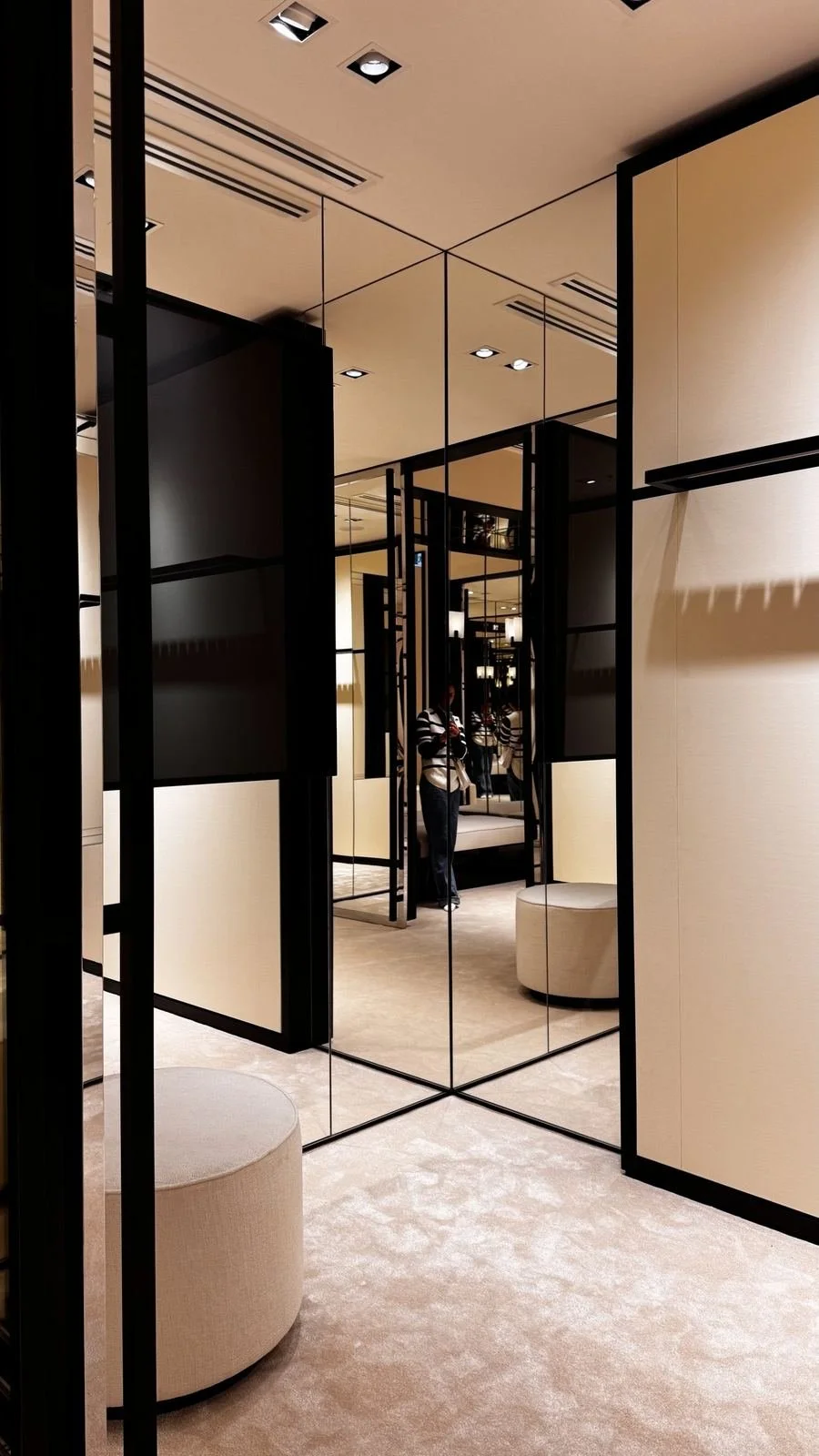 Mirrored panels and fitting room lounge