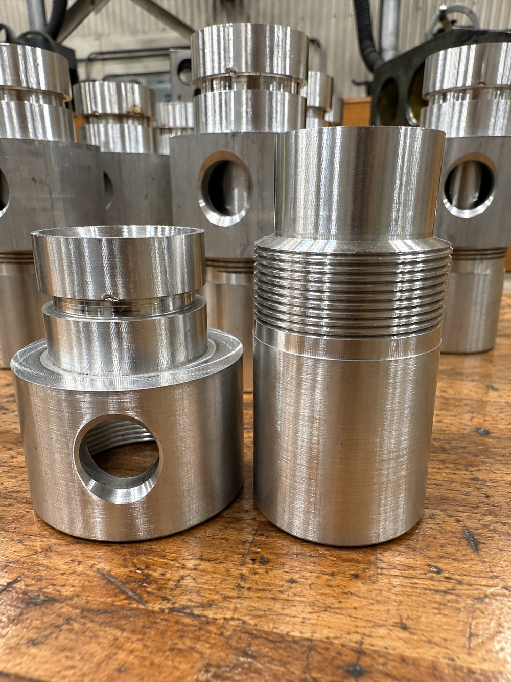 Machined aluminum fittings with external threads, made by UTP Solutions