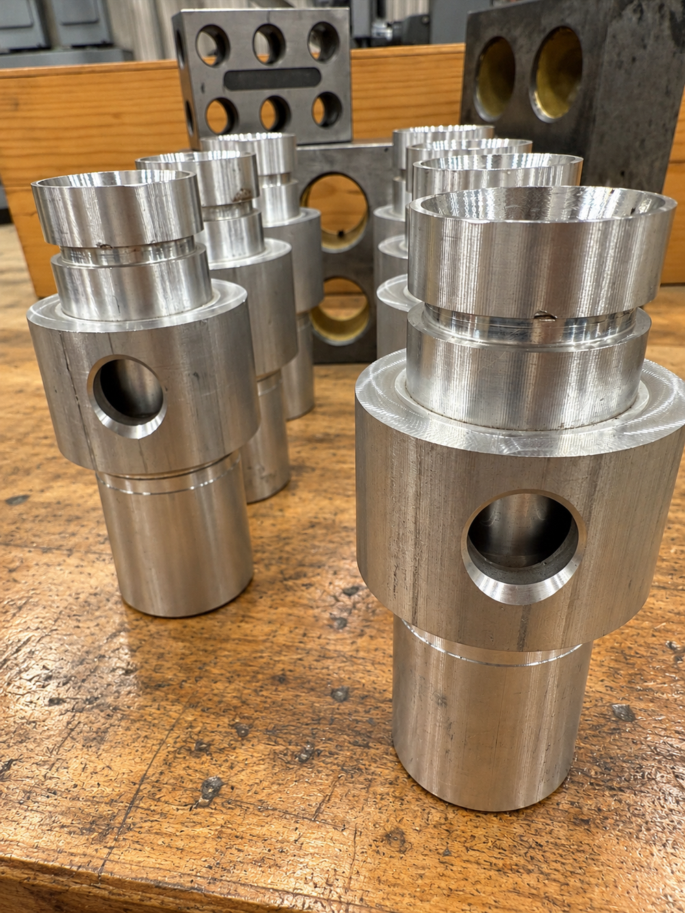 Precision-machined aluminum fittings with cross holes, made by UTP Solutions