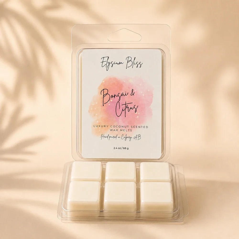 Open clamshell of Elysium Bliss Bonsai & Citrus coconut wax melts showing six cream-coloured cubes, on a warm cream background with soft palm-frond shadow.