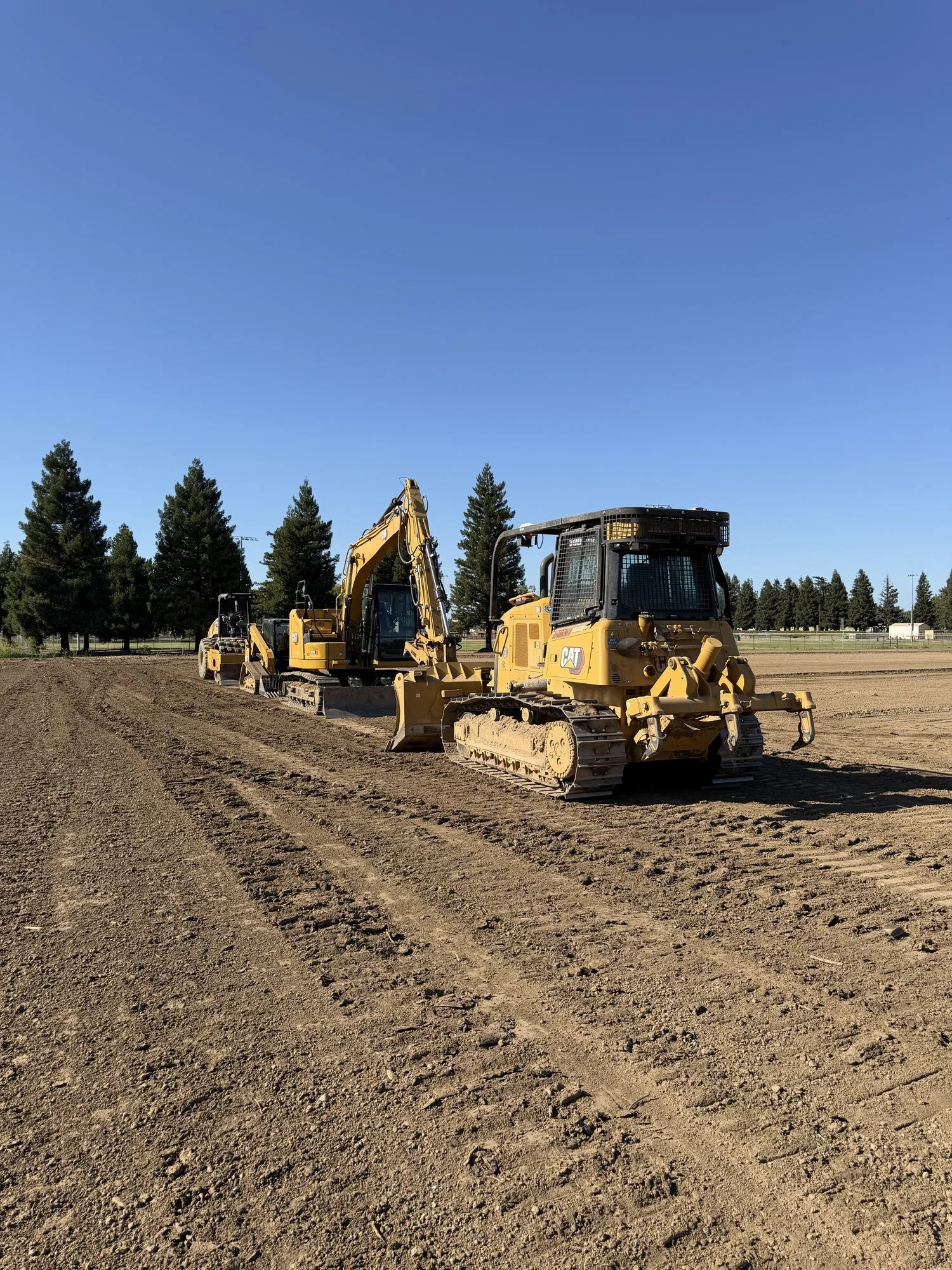 Scraper and dozer mass grading the self-storage site in Yuba City, CA