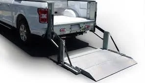 Small truck with Maxon lift gate ready for loading and unloading operations