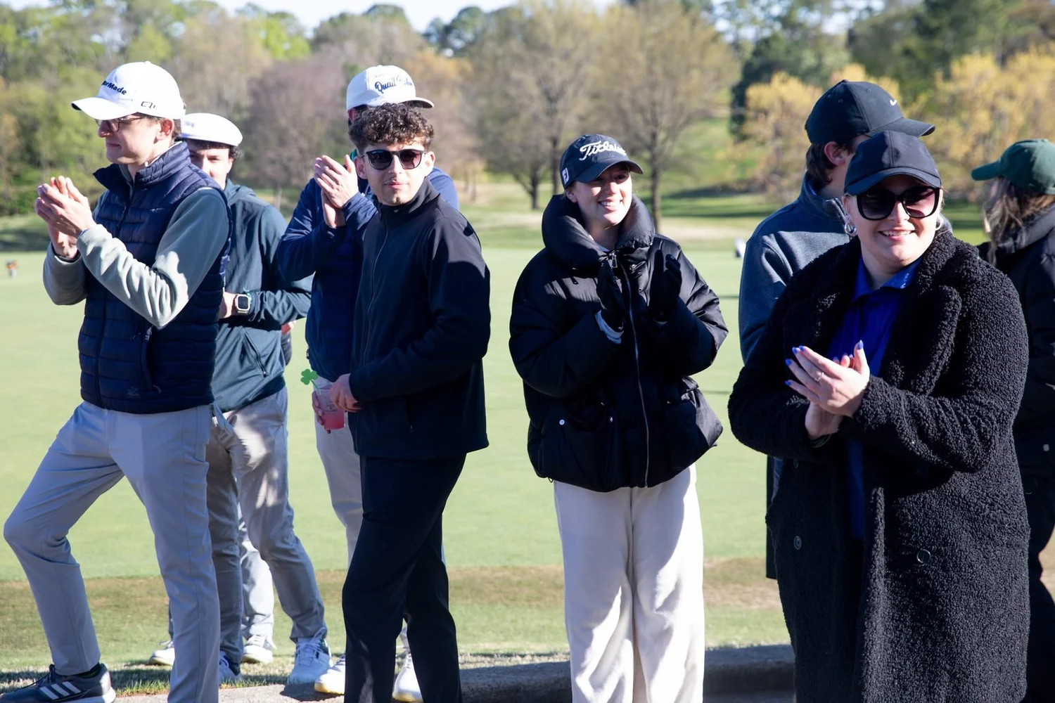 Golfers cheering on the green