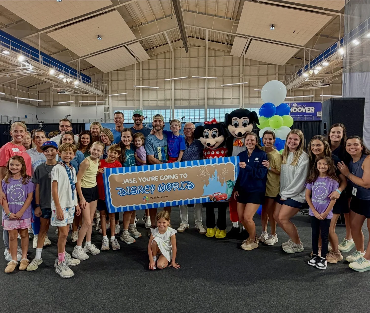 Magic Moments families and volunteers celebrating a wish