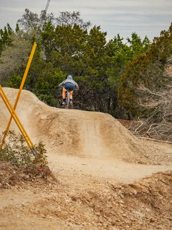 Step-up jump line with a rider dropping in from the top