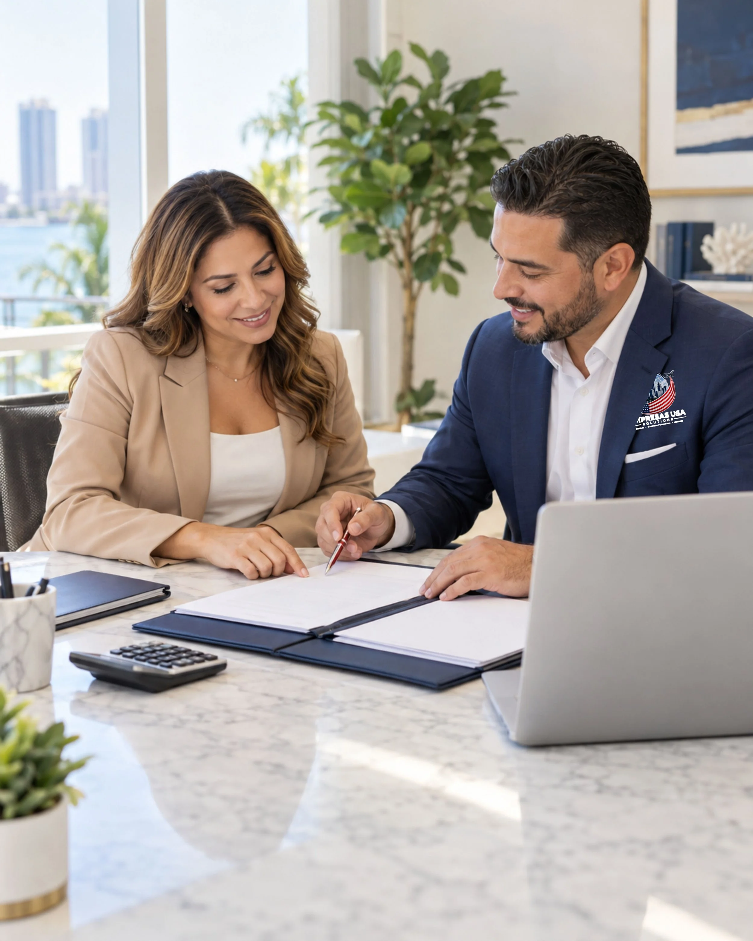 Advisor and client reviewing financing paperwork together in a bright office