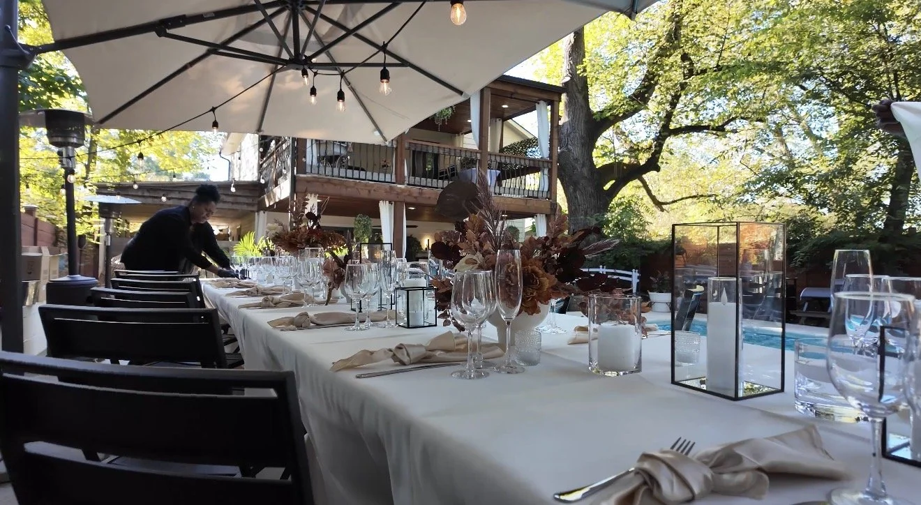 Table set poolside at Hill House at golden hour