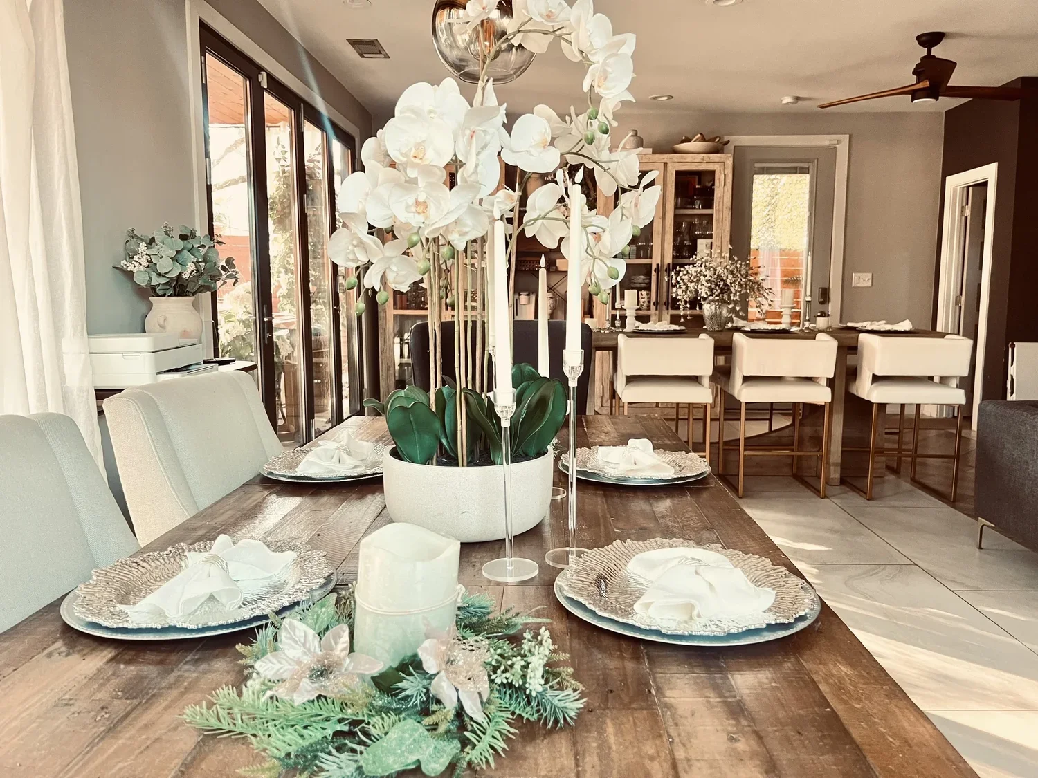 Table set with orchids and candlelight indoors