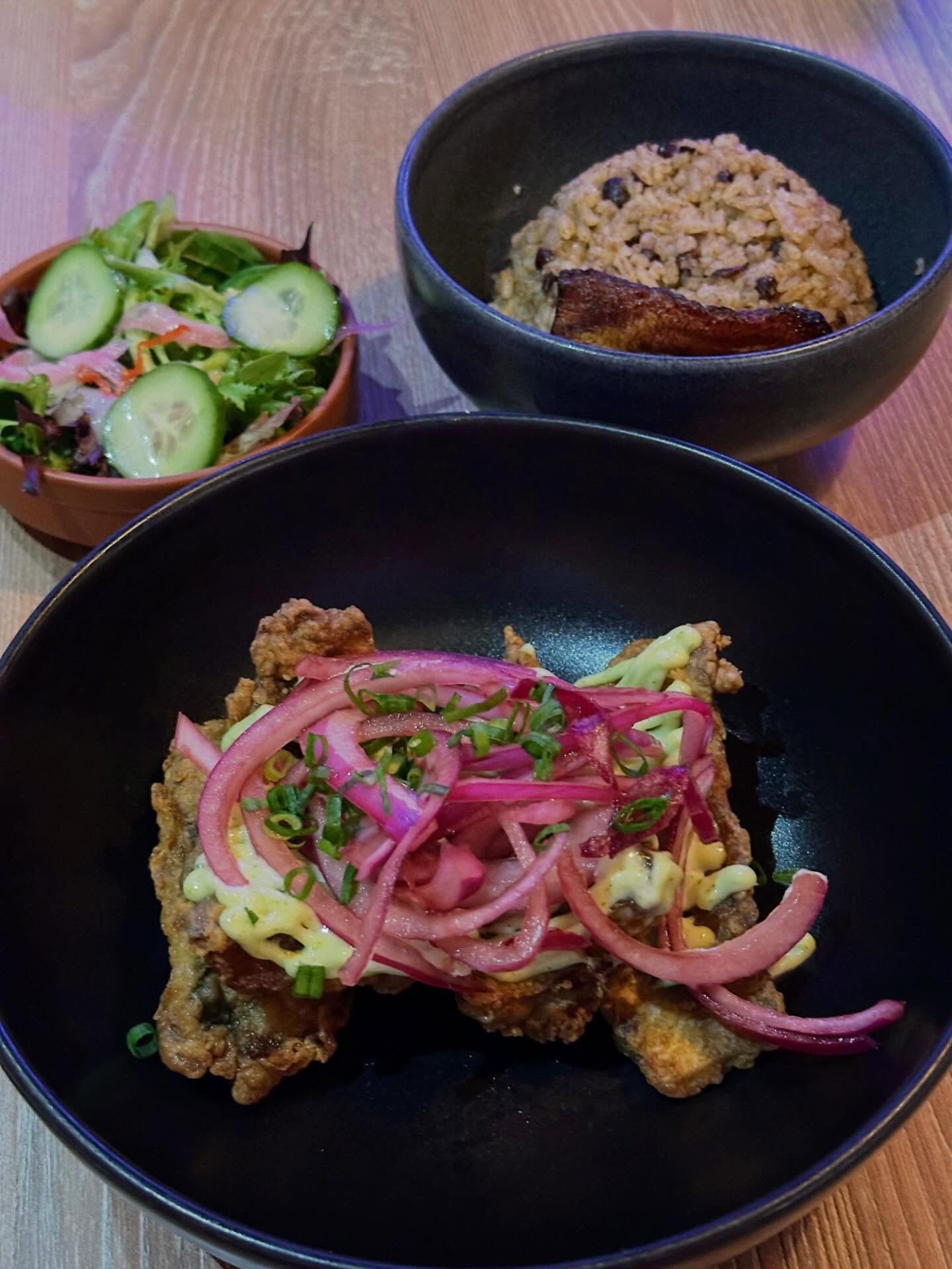 Fried fish with rice and cucumber salad at La Tapa del Coco