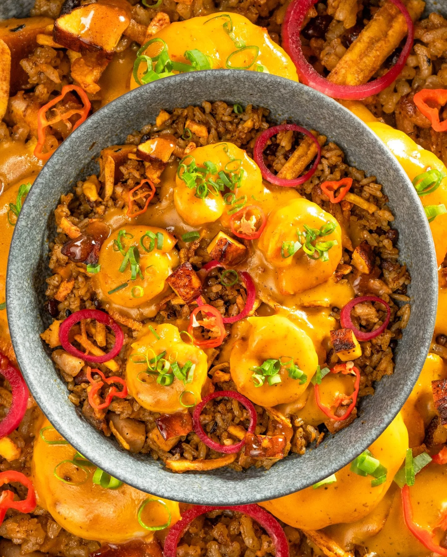 Seafood rice with yellow sauce and pickled peppers at La Tapa del Coco