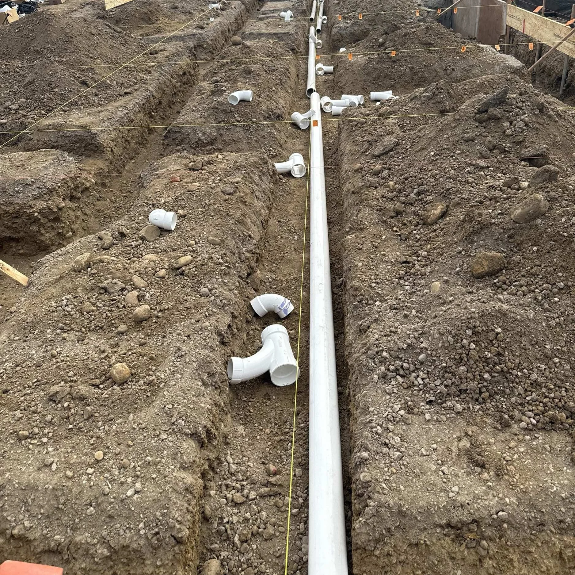 Underground plumbing laid in the footing trenches
