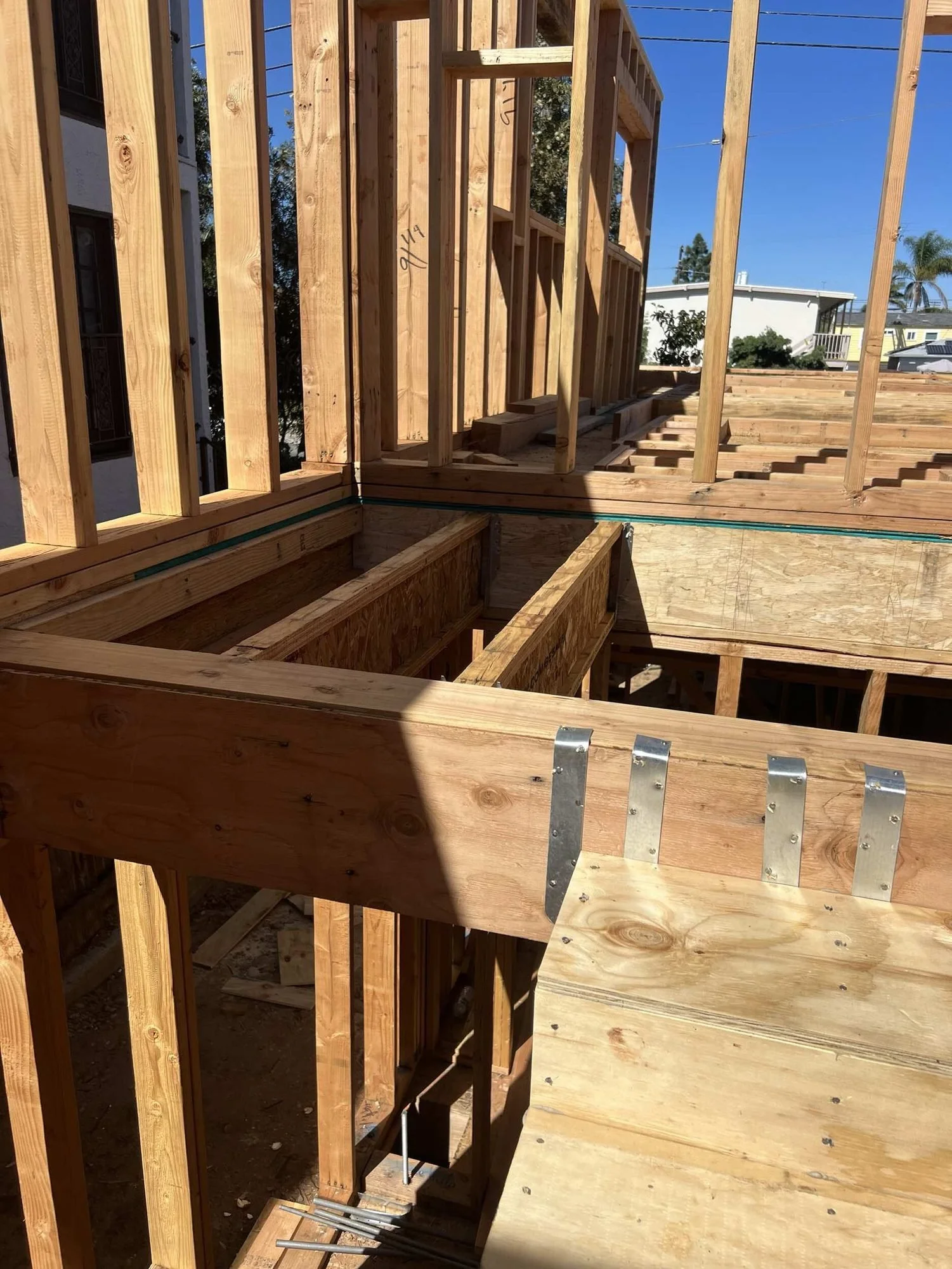 Stair opening framed with hangers on the second floor