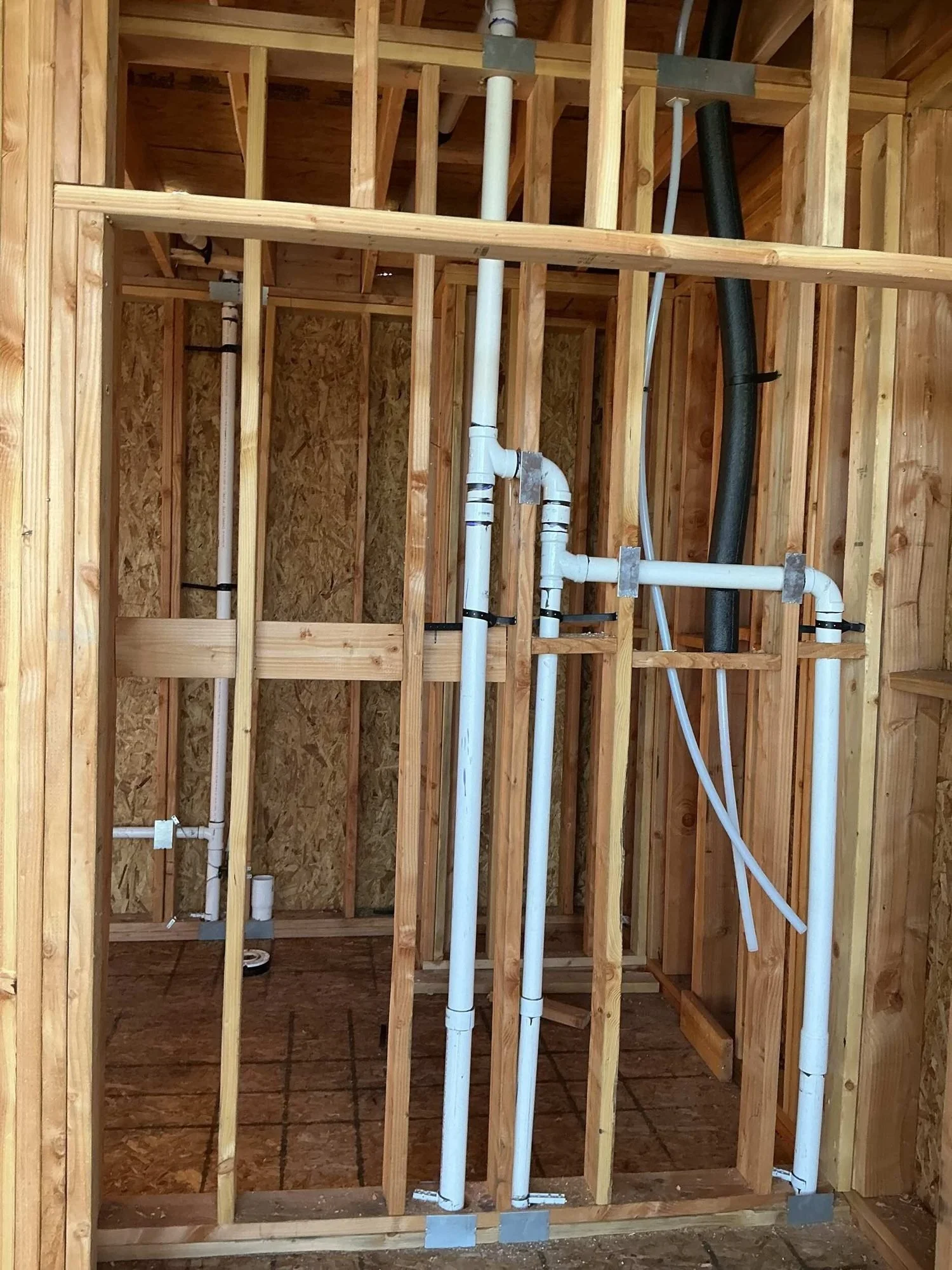 Bathroom plumbing rough in within framed walls