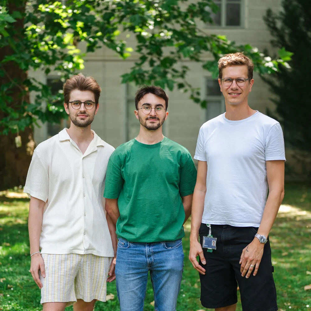 Three members of the Heilemann lab outdoors.