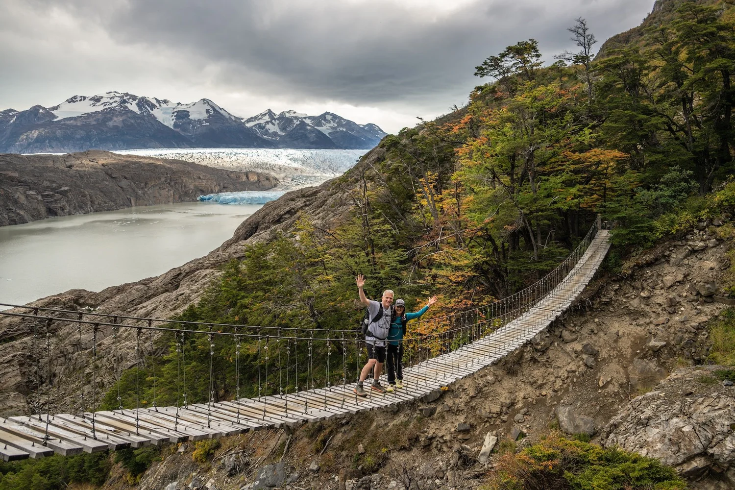 Crossing a suspension bridge with Grey Glacier behind