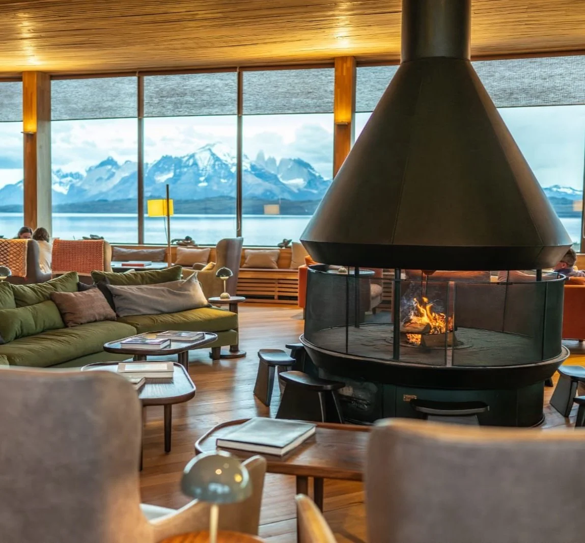 The lounge's conical fireplace at dusk