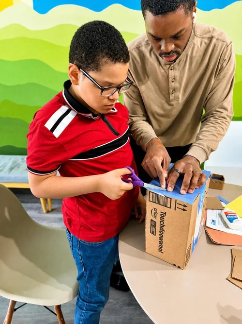 Building a cardboard house in crafts class