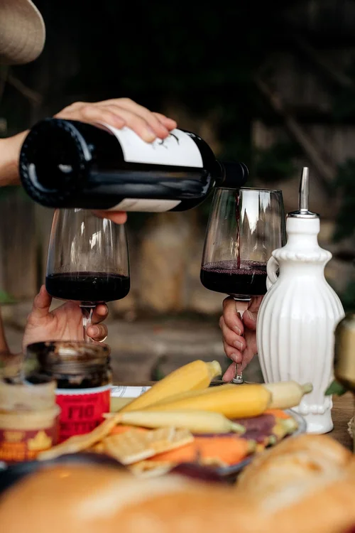 Wine poured at a garden table