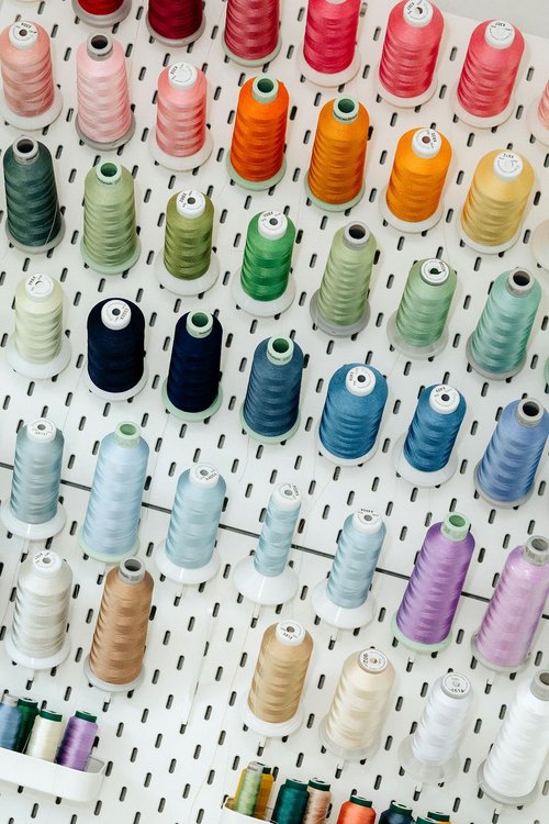 Wall of embroidery thread at The Scouted Stitch