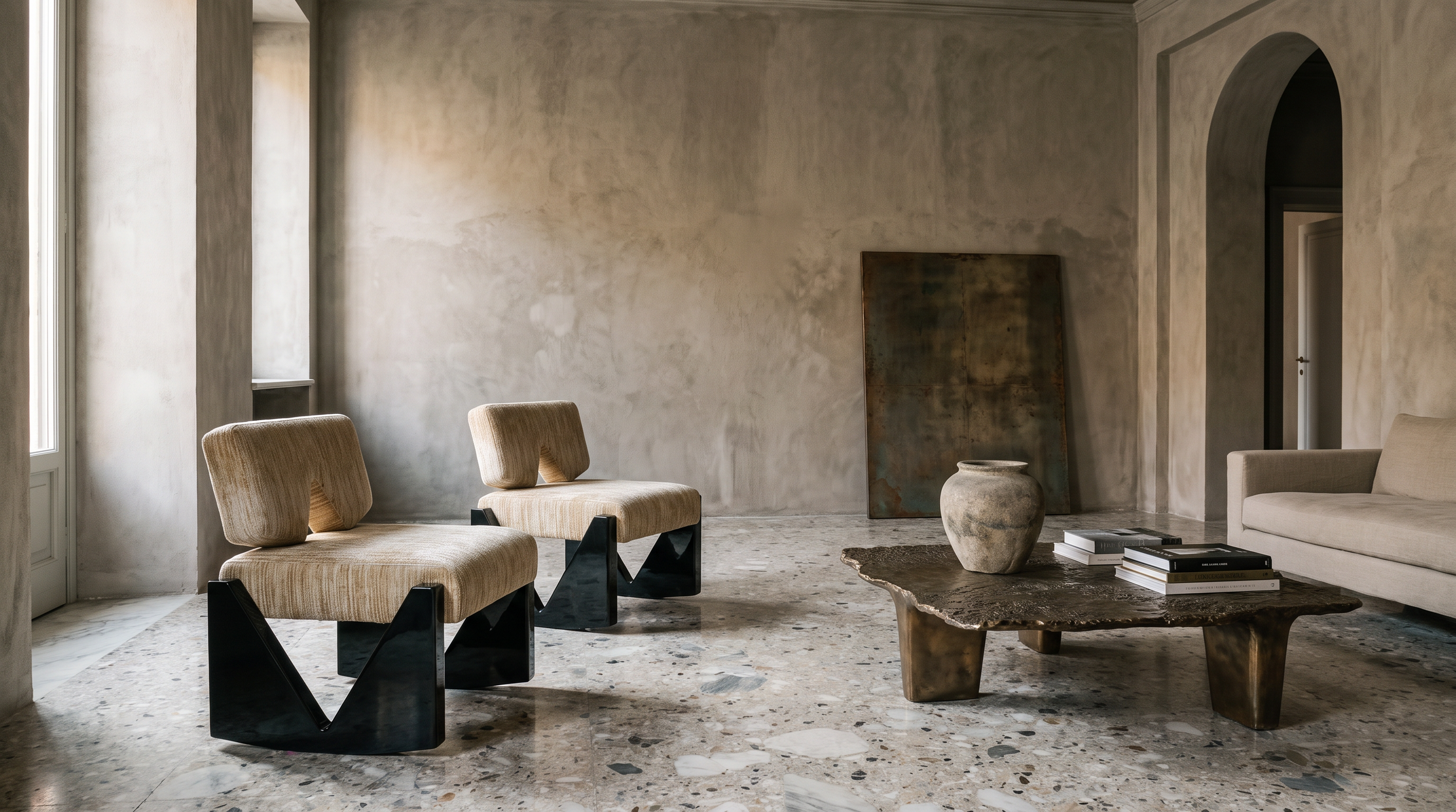 Slash Works Object 03 — pair of lounge chairs beside a bronze coffee table on terrazzo