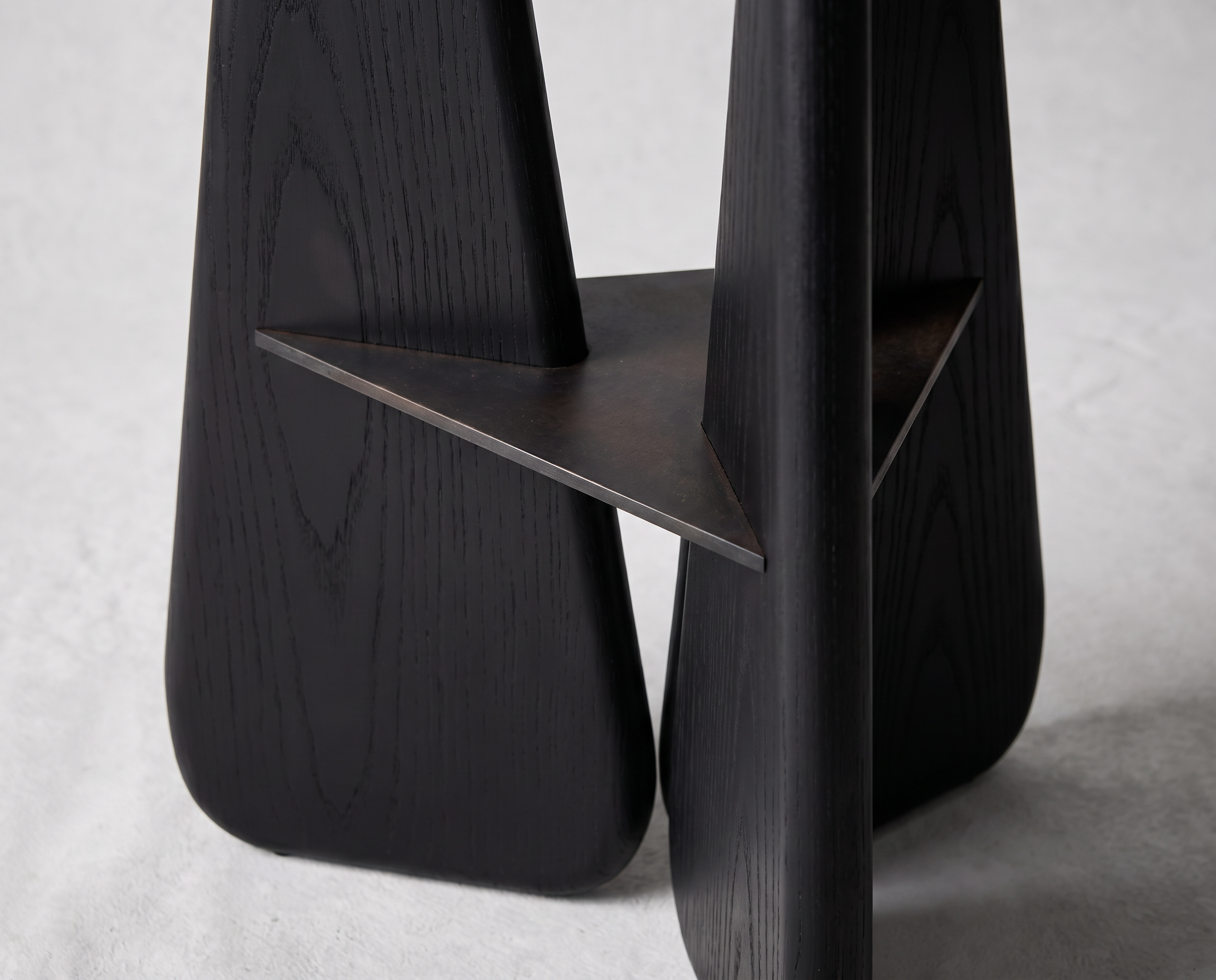 Slash Works Object 02 — close-up of the triangular metal shelf between the legs
