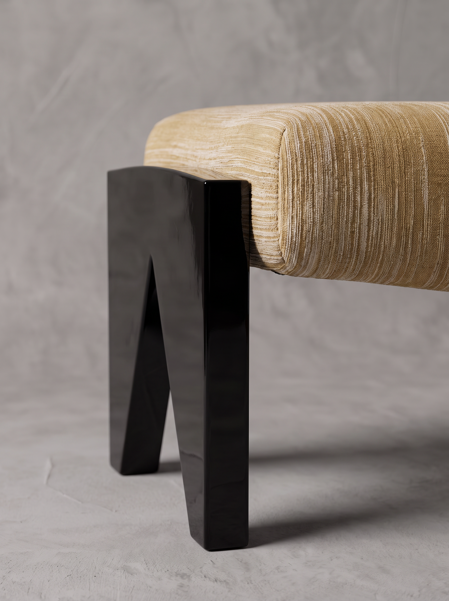 Slash Works Object 04 — close-up of the lacquered M-shaped leg and upholstered cushion