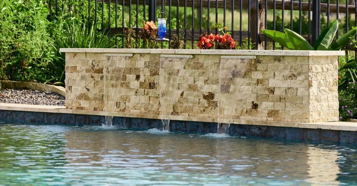 Scabos splitface travertine water feature detail — Horseshoe Bay TX