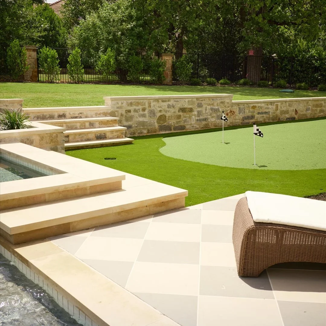 Putting green alongside custom pool — Larkin residence Georgetown
