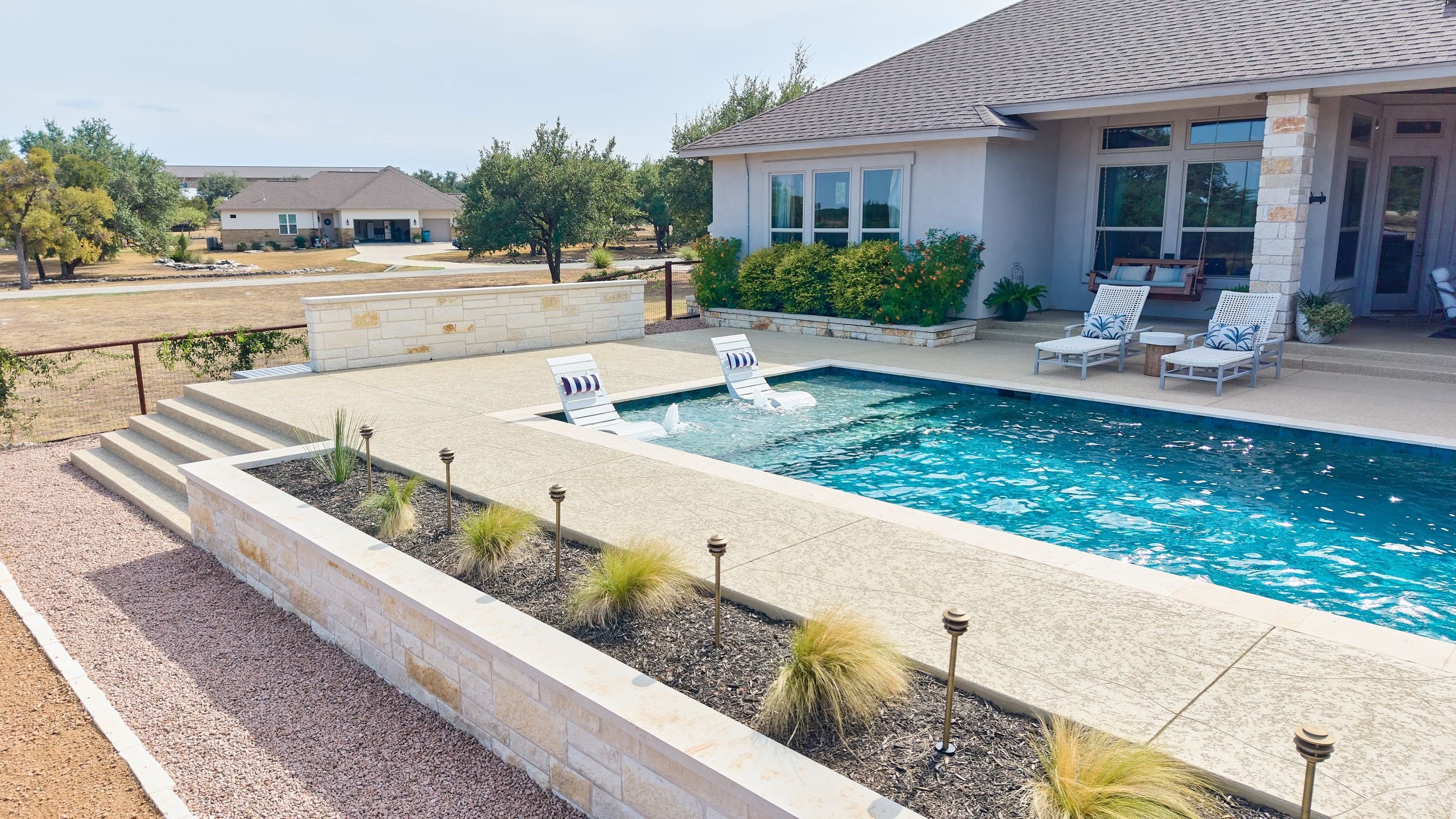Raised spa spillway detail — Spicewood Texas pool