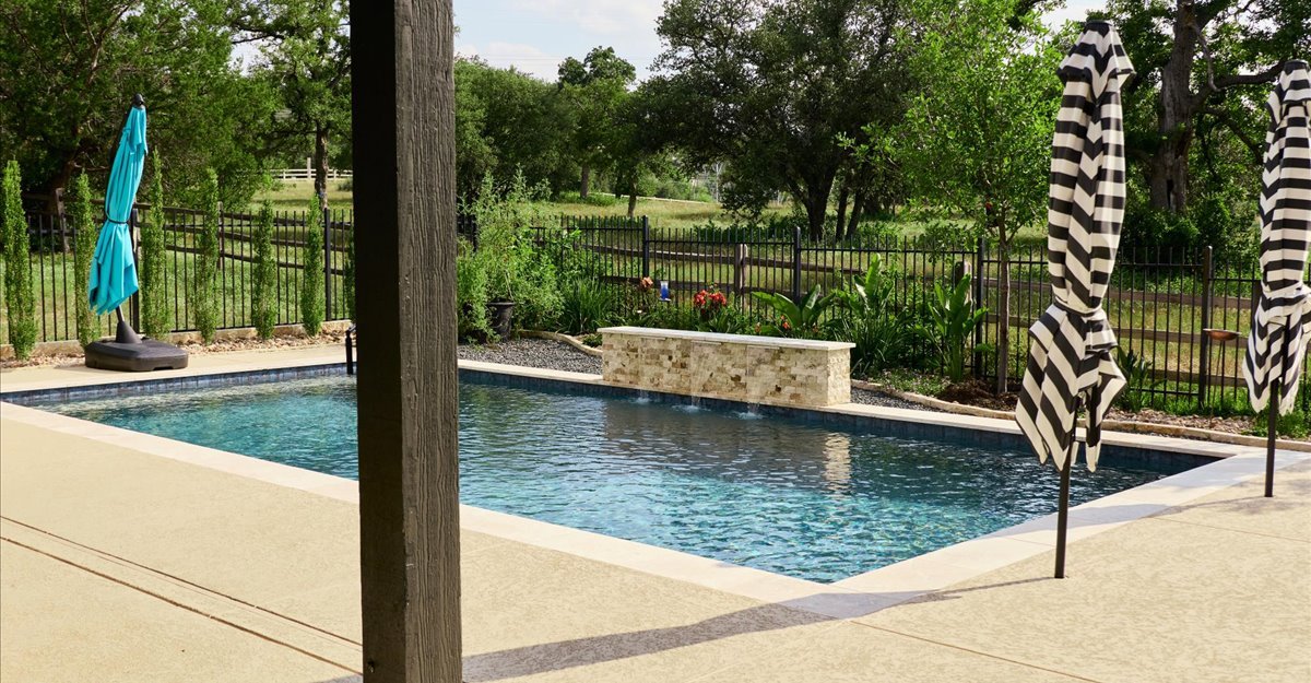 Patio with open field views — Horseshoe Bay Texas custom pool