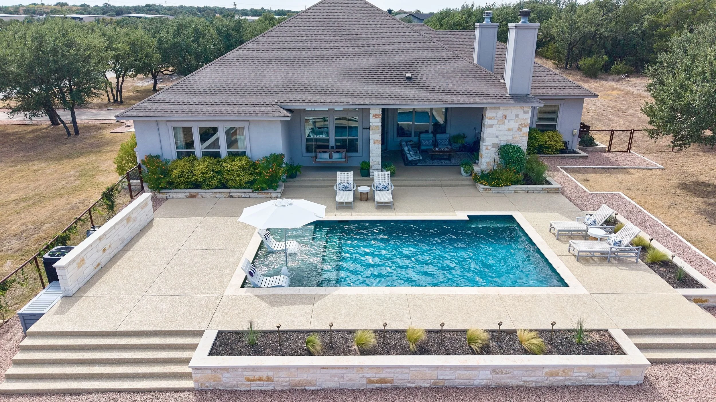 Aerial of pool and raised spa — Spicewood, TX