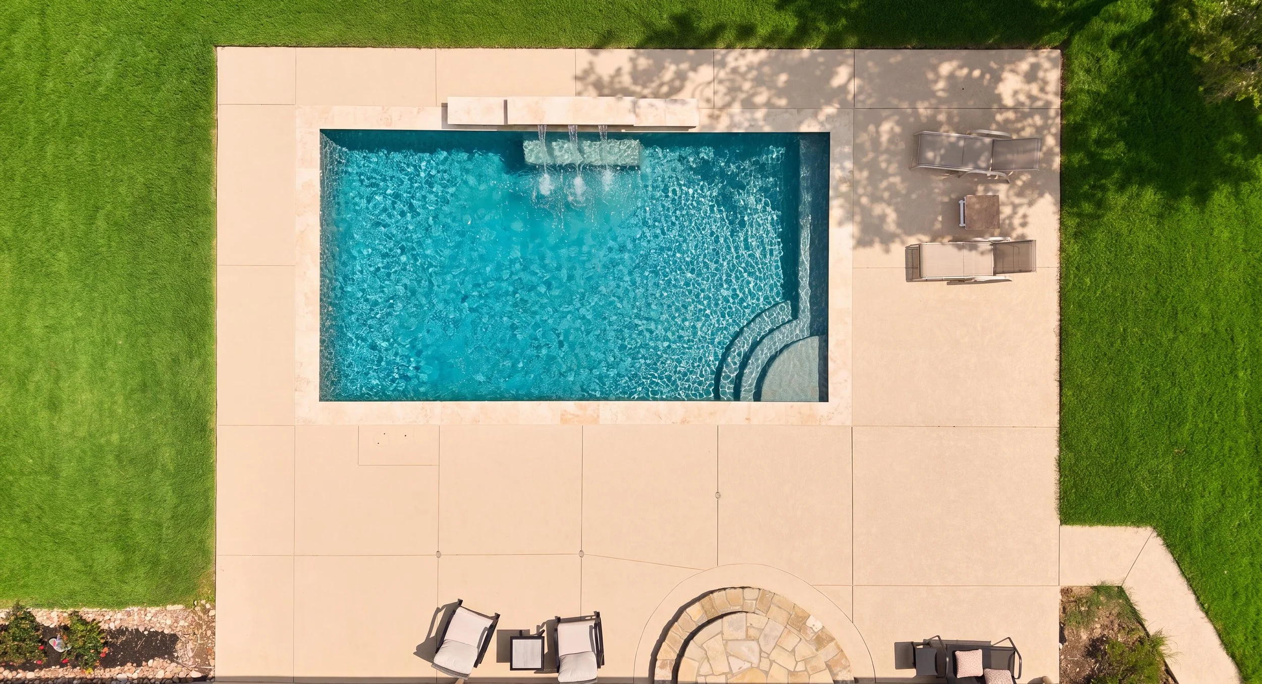Overhead aerial of pool with Walnut travertine coping — Kingsland TX