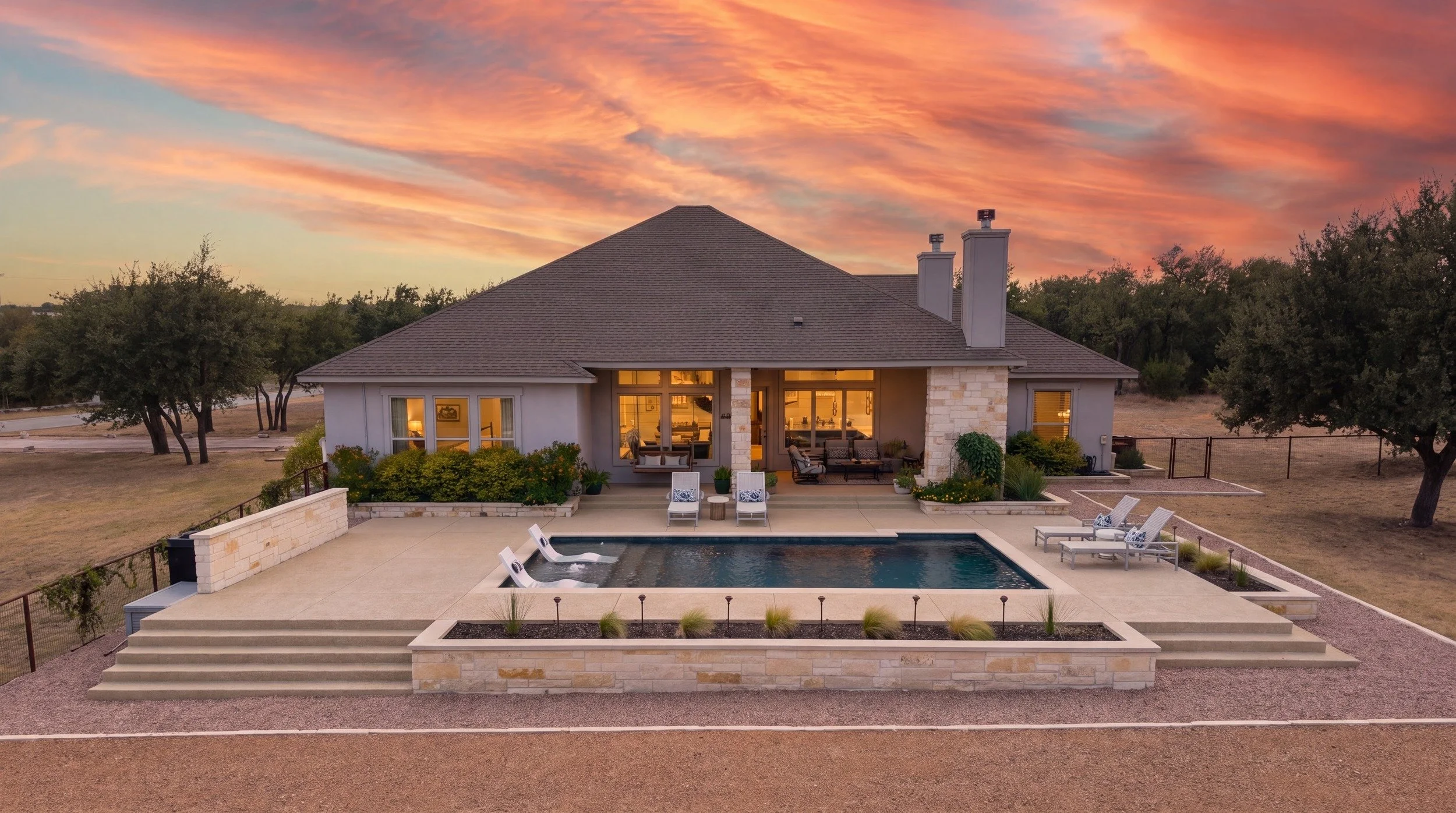 Custom gunite pool at golden hour — Spicewood, Texas