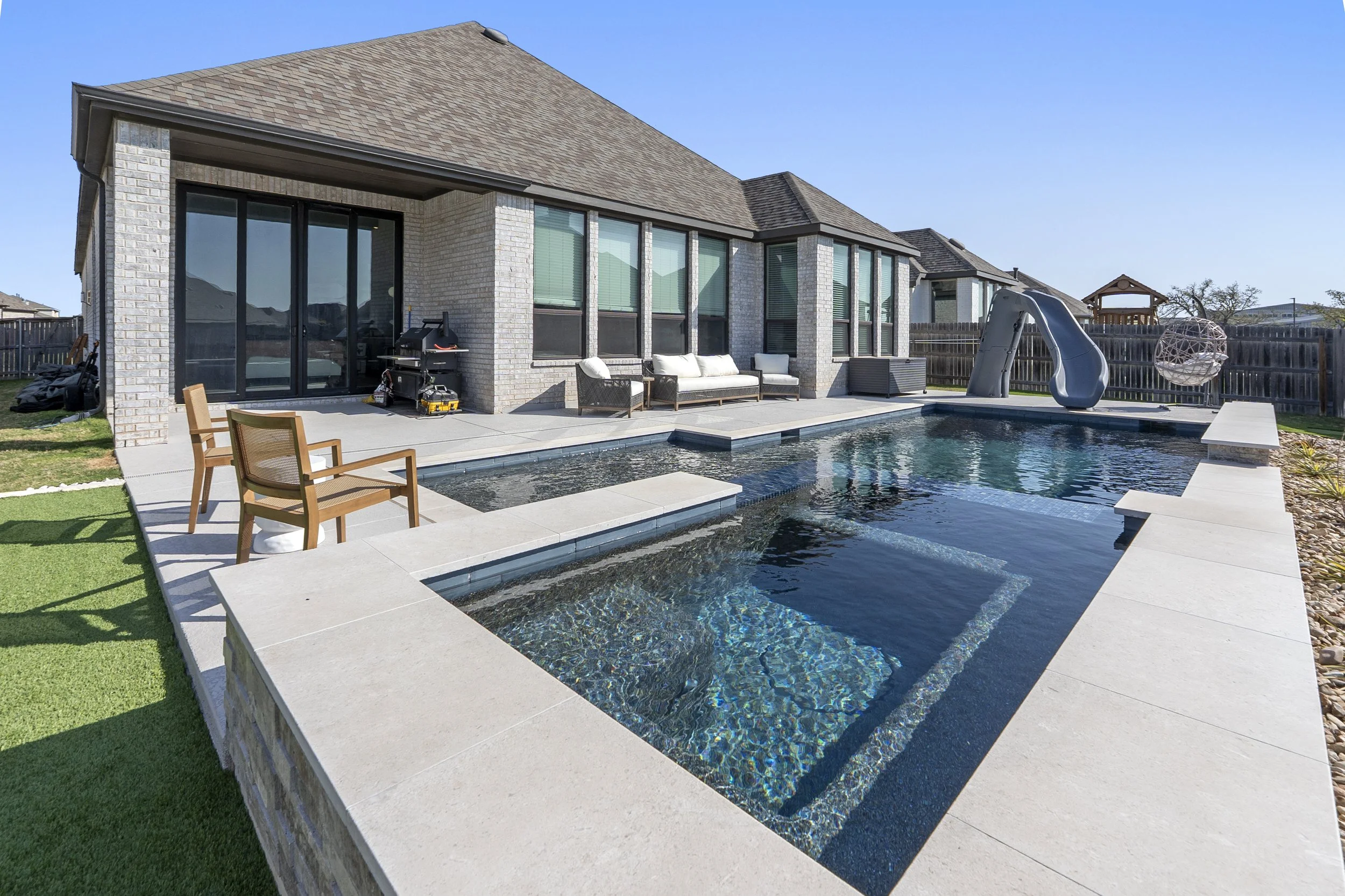 Freeform custom pool with premium tile and LED lighting