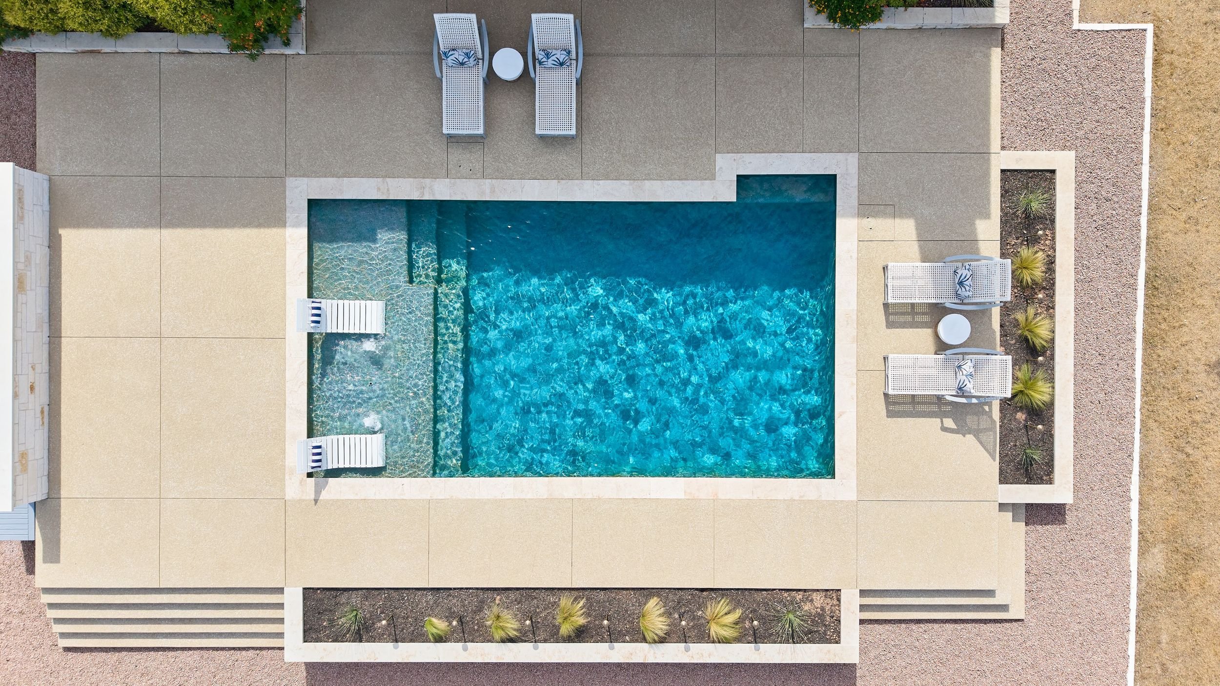 Overhead aerial of custom pool — Spicewood, TX