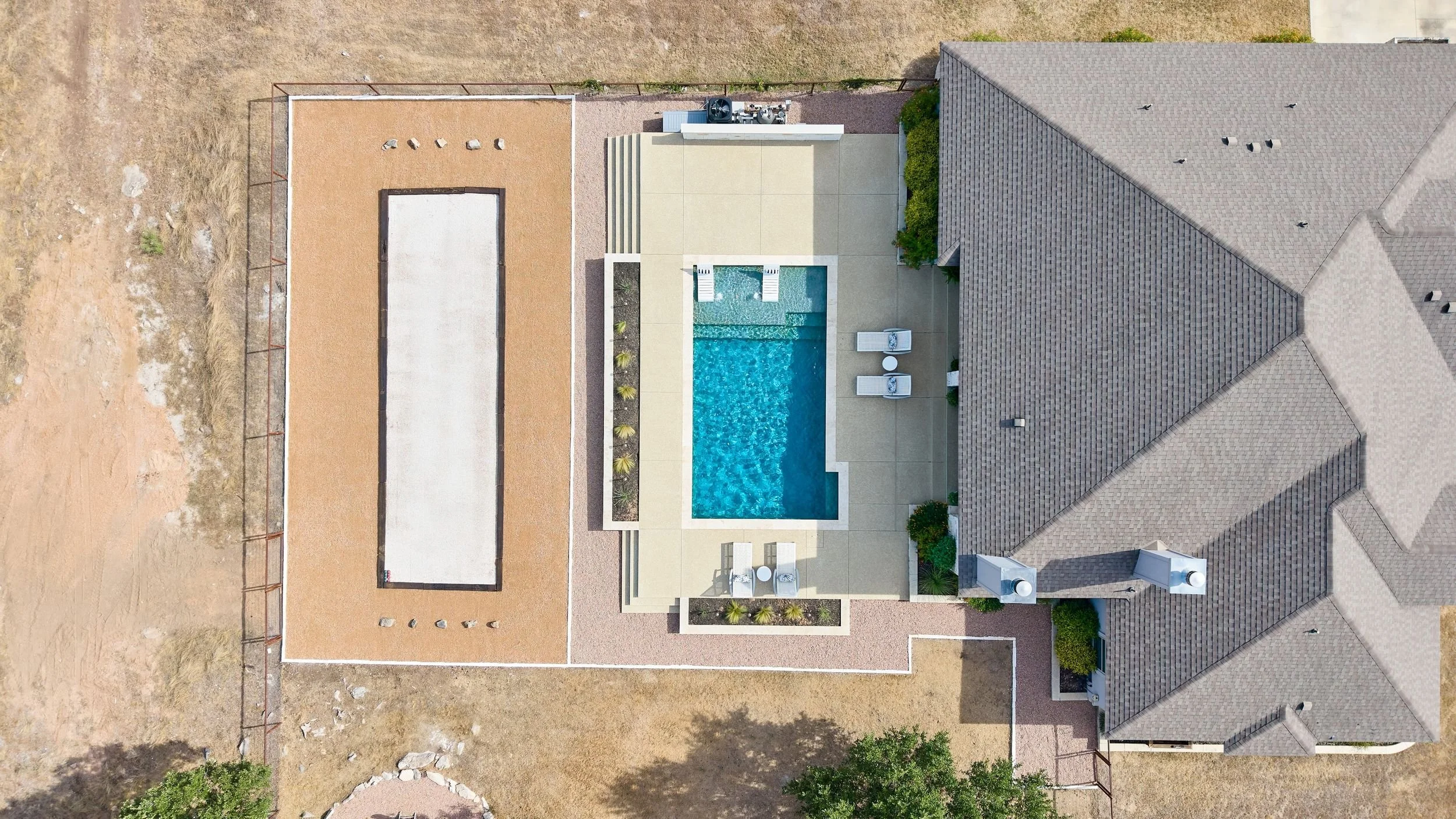 Aerial view of full property and pool — Spicewood Texas