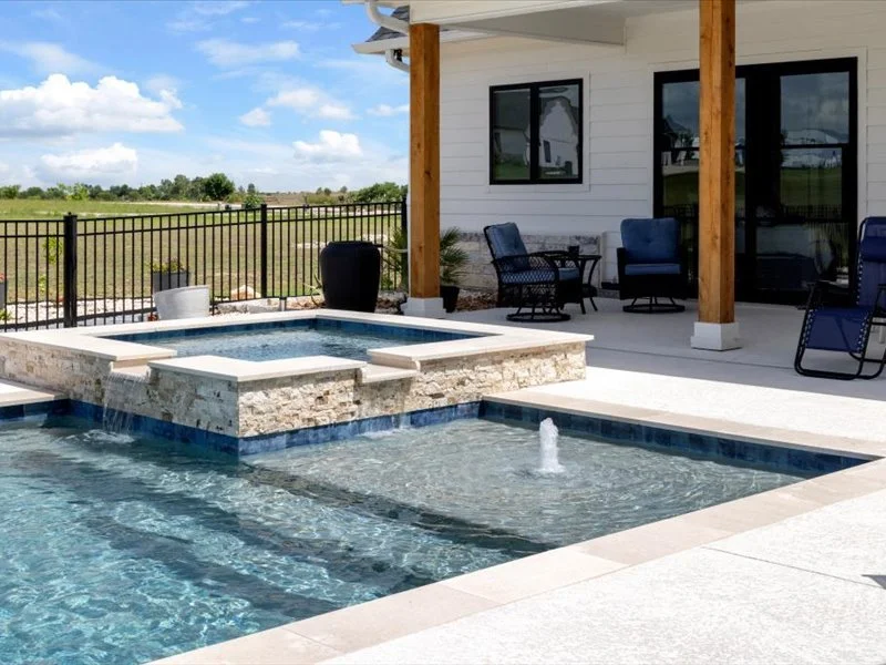 Raised spa spillway detail — Platinum Ice coping, Salado Texas